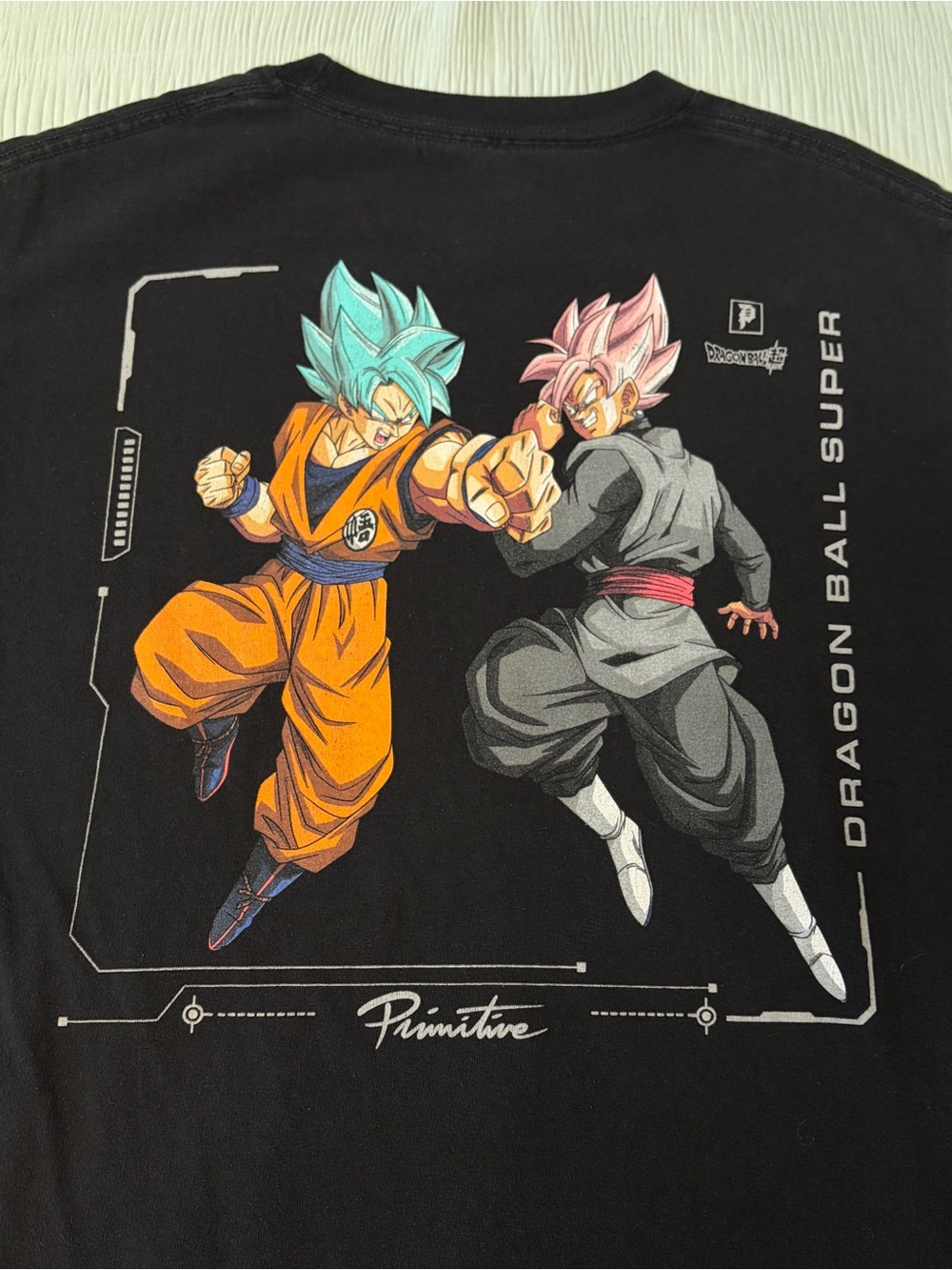 Primitive Black Tee with Orange, Teal & Pink Dragon Ball Super Art